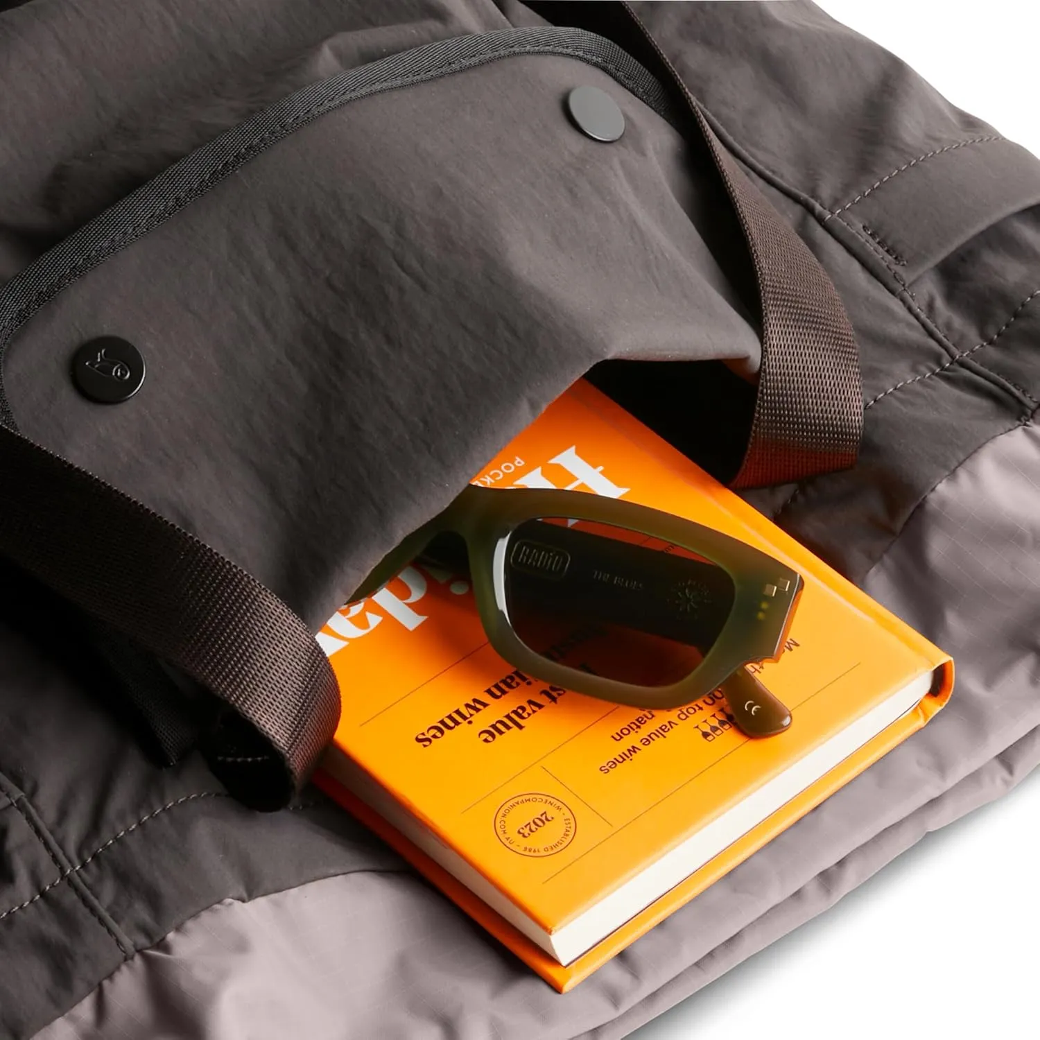 Bellroy Cinch Tote (16 liter lightweight tote bag with external organization, pop pockets, a luggage pass-through, and effortless draw-cord closure) - Charcoal